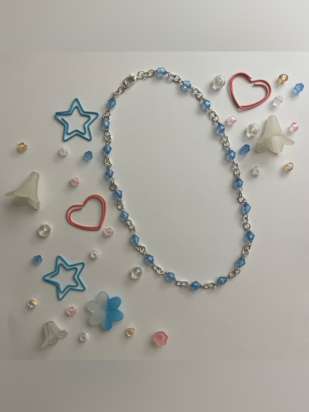 Silver chain necklace with blue beads